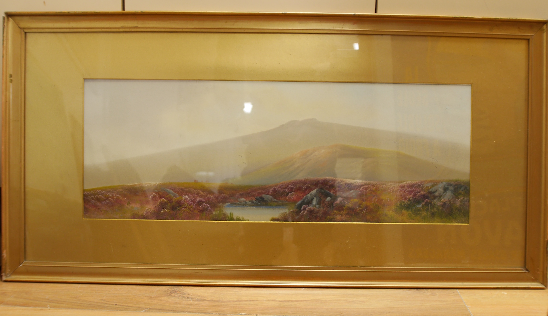 Manner of Reginald Daniel Sherrin (1891-1971), gouache, Moorland landscape, unsigned, 27 x 56cm, gilt framed. Condition - good